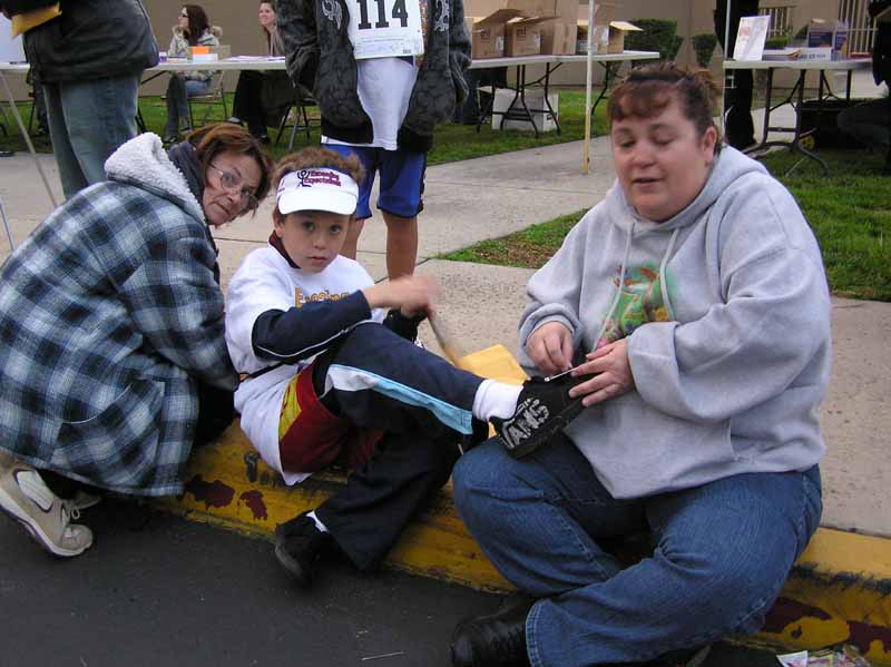 020 First time using a timing chip for Tyler Thompson, so Mom (who works at Cypress Elementary) and Grandma assist 