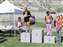 Isi (far left), and Stephanie (far right, in her jammies) take fourth and third places in their division.